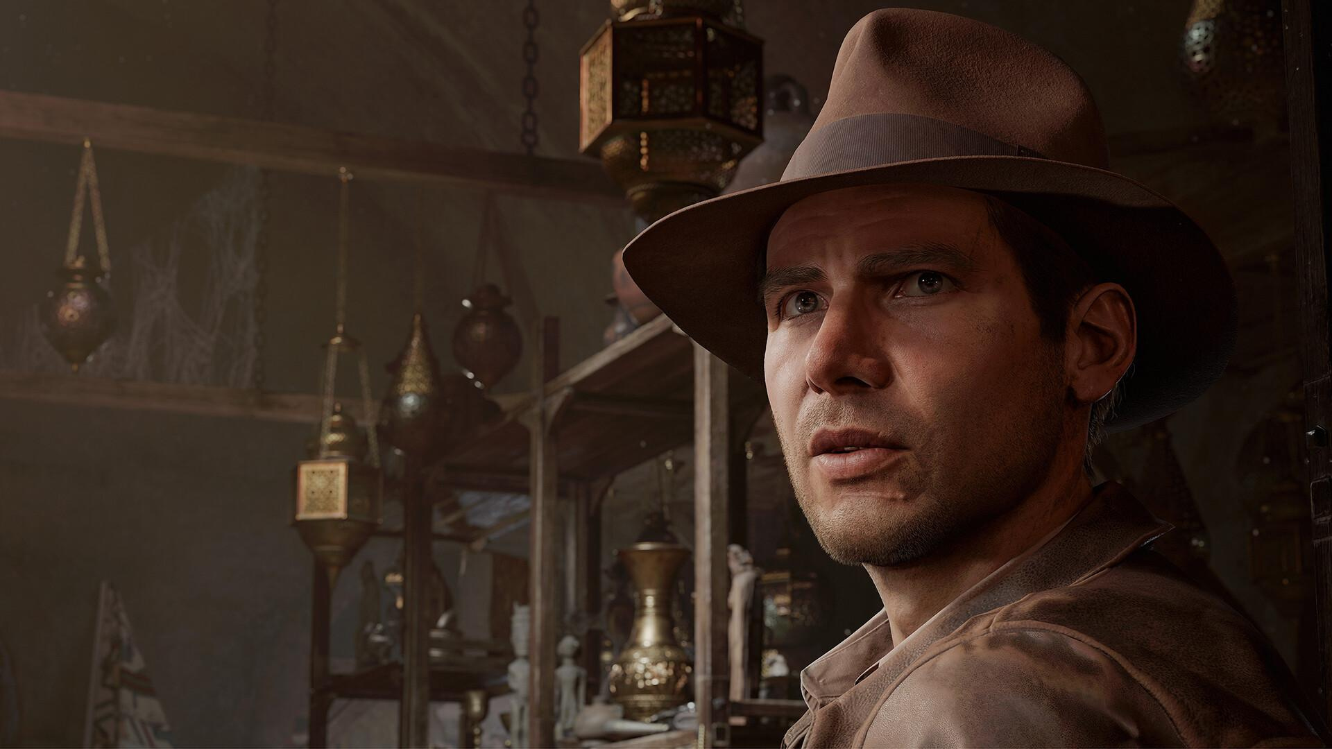 Indiana Jones, with his trademark fedora on, turns to face the camera in front of shelves stacked with artifacts in The Great Circle